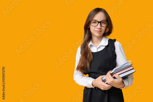 Cute schoolgirl with books ...