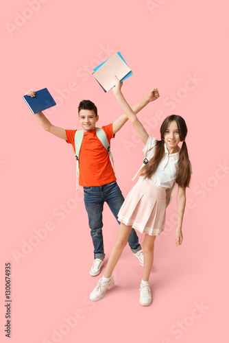 Happy schoolchildren with s...