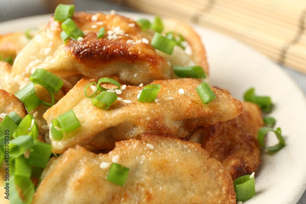Tasty fried gyoza (dumplings) on table, closeup Tasty fried gyoza (dumplings) on table, closeup