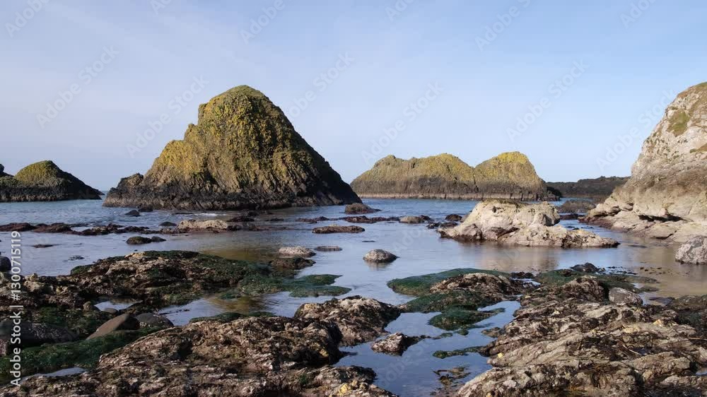 Dramatic unspoiled rocky seascape natural Celtic beauty Atlantic Ocean Causeway Coast Northern Ireland Ballintoy, bright sunny day blue sky view Dramatic unspoiled rocky seascape natural Celtic beauty Atlantic Ocean Causeway Coast Northern Ireland Ballintoy, bright sunny day blue sky view