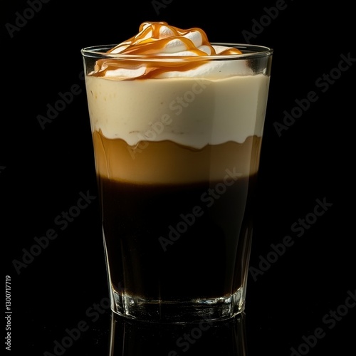 offee frapuccino, thin and even glass. dark at bottom. swirls in the middle. cream with caramel sauce on top photo