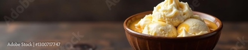 A bowl of iced coffee and creamy vanilla ice cream sits on a dark wooden table, vanilla, cold, coffee