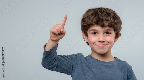 Genius at Work – Clever Young Boy Points to His Head, Thinking Deeply