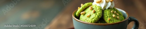 Freshly baked matcha cookies in a gray cup with whipped cream and nuts, desserts, cookies