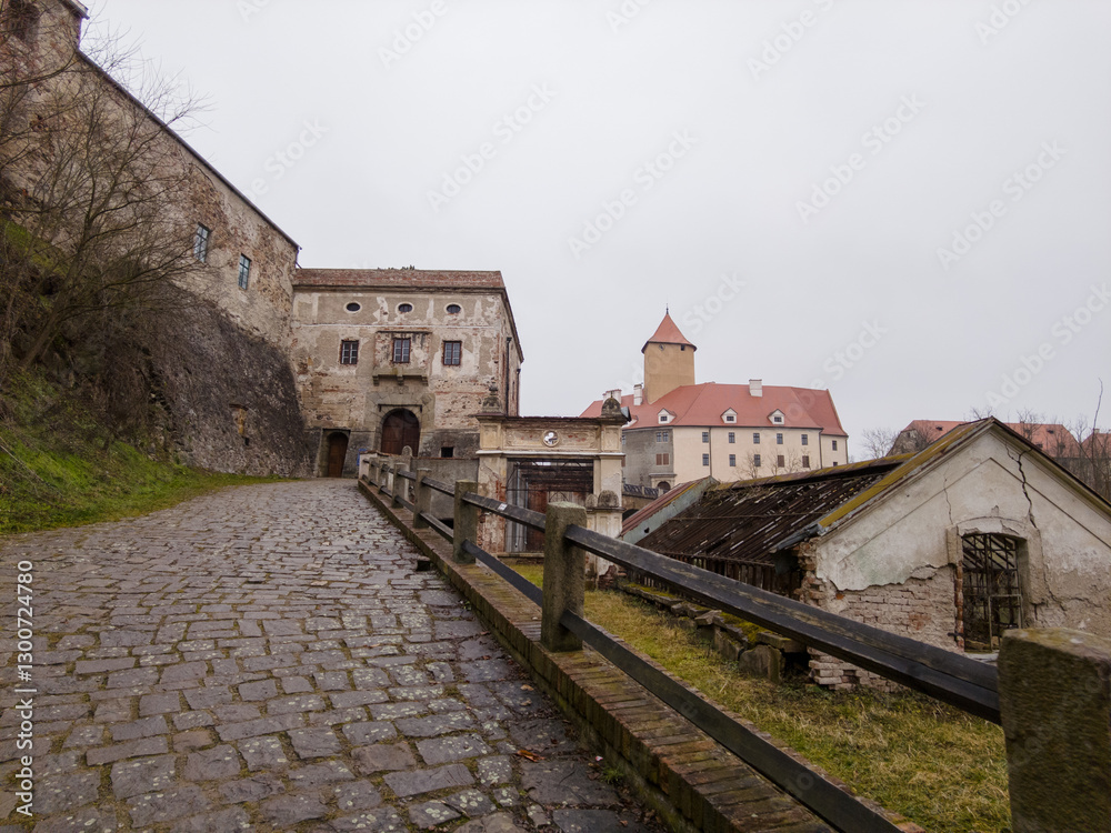 Fototapeta premium Brno, Czech Republic - January 25, 2025: View of Veveří Castle - a royal castle, a monument of medieval architecture, on a wooded cape near the Brno Reservoir, at a sharp bend in the Svratka River
