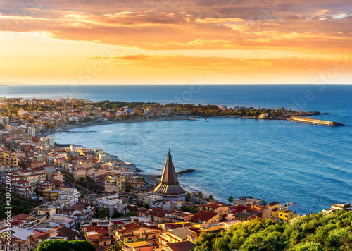 Picturesque view of small italian town with charming architecture and stunning seaside view on mideterranean coast, popular travel and holyday destination in Italy