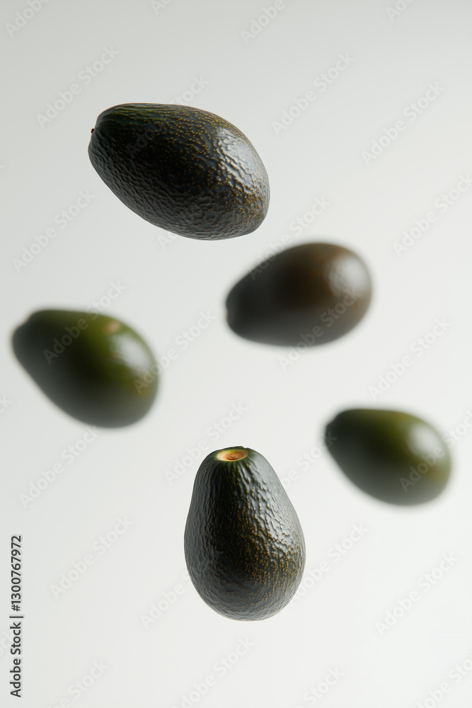 Avocados floating in the air on a white background, creating a weightless effect Avocados floating in the air on a white background, creating a weightless effect