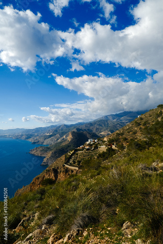 The sea and mountains are landscaped with clouds and sunny weather. Mirador de Cerro gordo