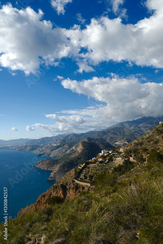 The sea and mountains are landscaped with clouds and sunny weather. Mirador de Cerro gordo