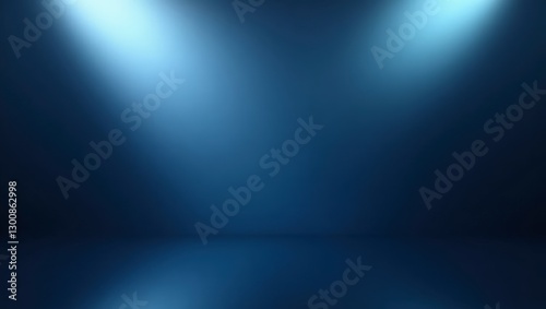 Two focused spotlights illuminate a textured gradient blue background in a serene studio setting.