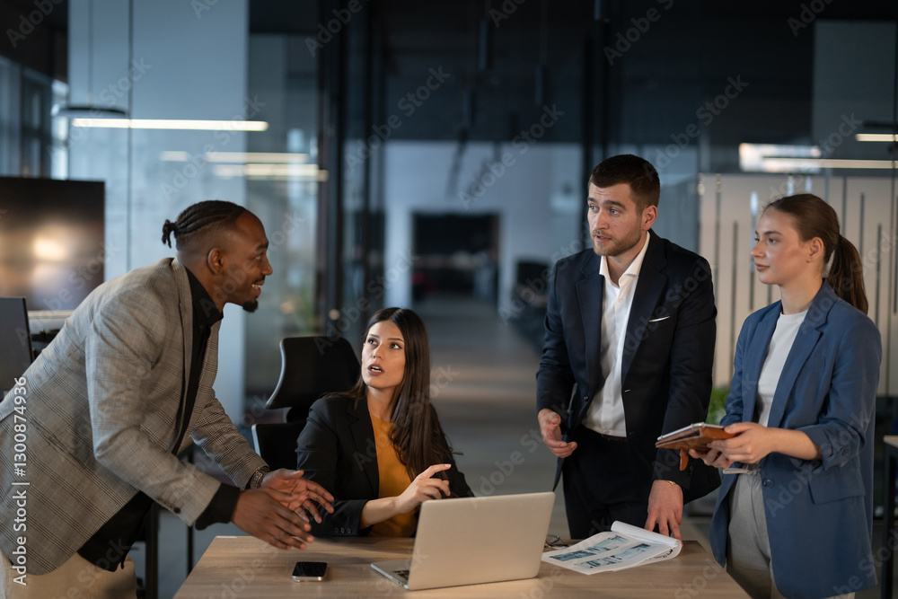 Diverse business team in discussion at a modern office, engaged in a professional meeting. Concept of teamwork, corporate collaboration, and workplace communication