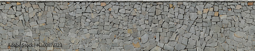 Stone texture of irregular gray basalt slabs dryjoint wall cladding