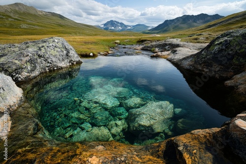 A hot spring flowing into a river, with small waterfalls creating a tranquil and picturesque scene