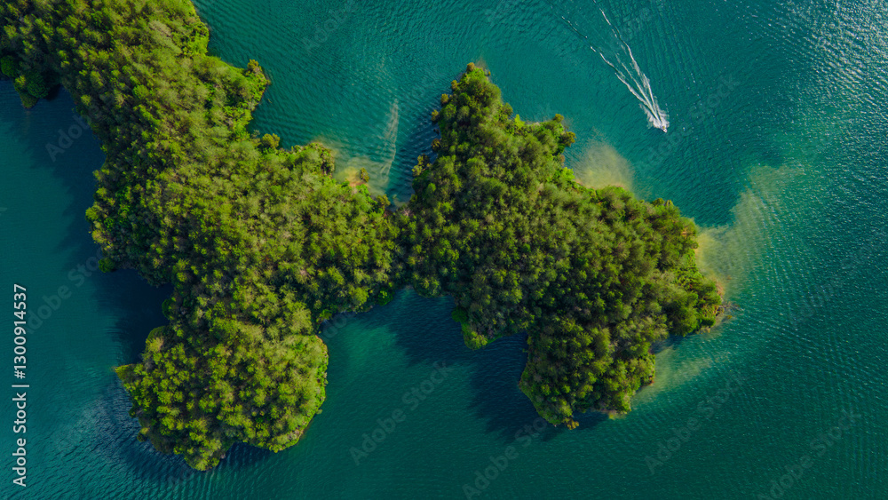 Aerial View of Lush Green Islands Surrounded by Crystal Clear Waters in Guatape, Antioquia, Colombia Aerial View of Lush Green Islands Surrounded by Crystal Clear Waters in Guatape, Antioquia, Colombia