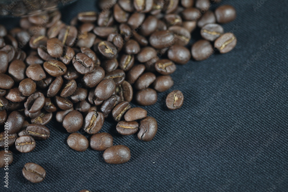 Roasted Coffee Beans Close-up: Aromatic roasted coffee beans cascade over a textured surface, inviting the rich flavors. Photorealistic texture and a warm inviting tone. Roasted Coffee Beans Close-up: Aromatic roasted coffee beans cascade over a textured surface, inviting the rich flavors. Photorealistic texture and a warm inviting tone.