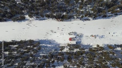 Skiers and snowboarders enjoying winter activities at ski resort