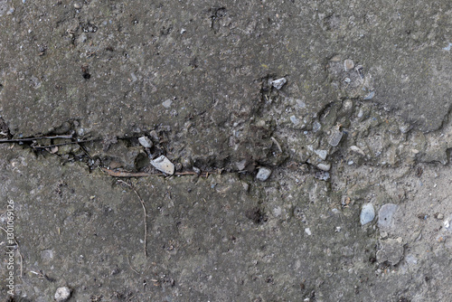 Background of destroyed concrete path, gray concrete, concrete texture, close-up. Natural photo. Old concrete slab