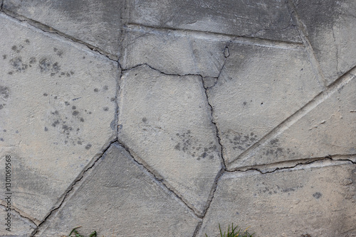 Background of destroyed concrete path, gray concrete, concrete texture, close-up. Natural photo. Old concrete slab