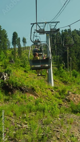 Wallpaper Mural Tourists lift to top of mountain on cable car in summer. Enjoying leisure time together on holiday. Hotel area surrounded by hills and forest slow motion Torontodigital.ca