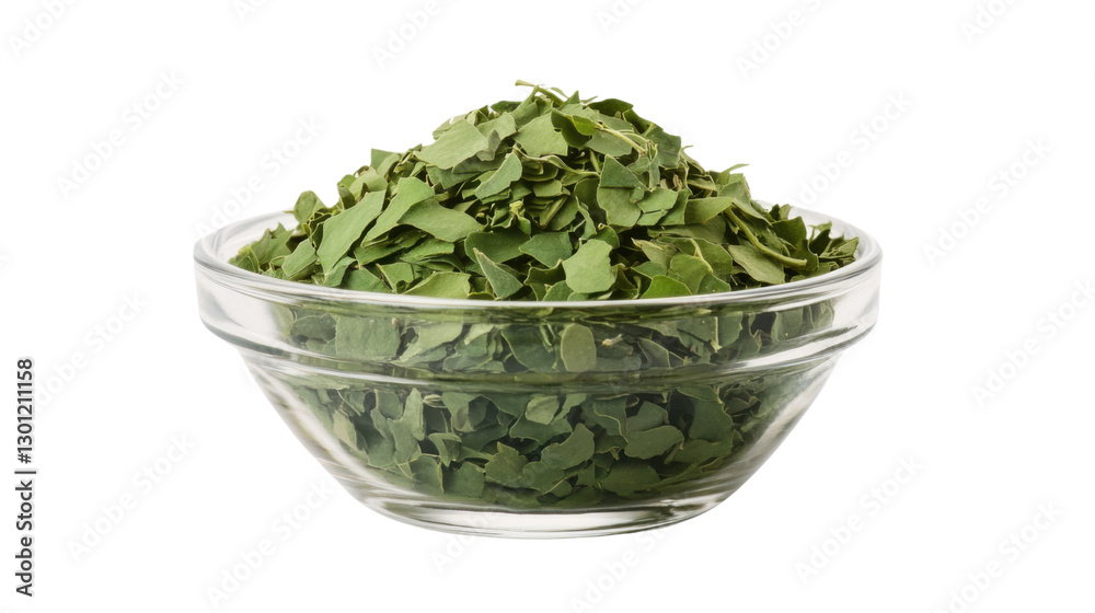 Glass bowl filled with dried moringa leaves isolated on white background Glass bowl filled with dried moringa leaves isolated on white background