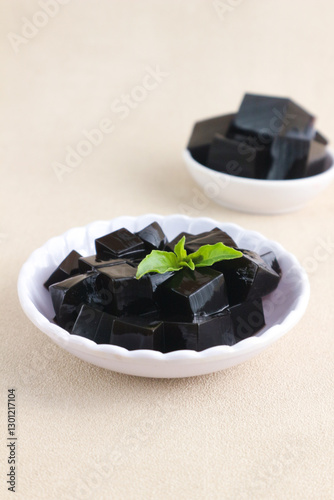 cincau hitam is black jelly made from the leaves of mesona palustris or other mesona family plant. its One of the popular ingredient desert menu when breaking the fast. selected focus photo