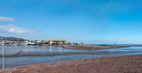 South west England coastal image with a scenic estuary and golden red sand. Vacation and holiday tourism. photo