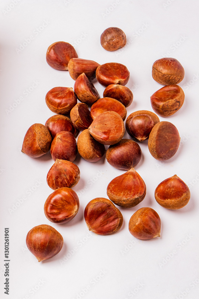 raw edible chestnuts on the white background raw edible chestnuts on the white background