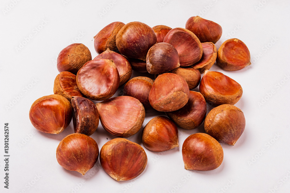 raw edible chestnuts on the white background raw edible chestnuts on the white background
