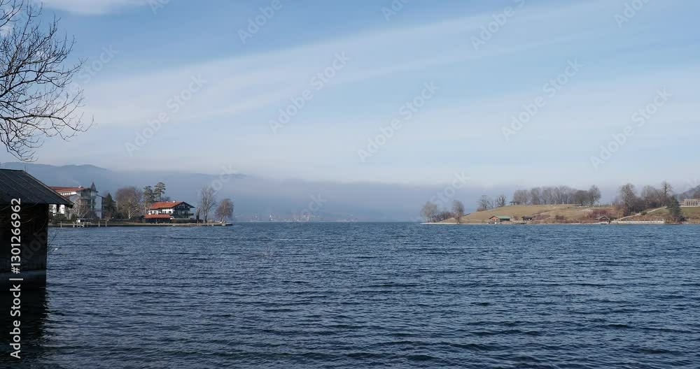 Lake Tegernsee in the Bavarian Alps, seen from Rottach Bay and the lake promenade south of the village of Rottach-Egern