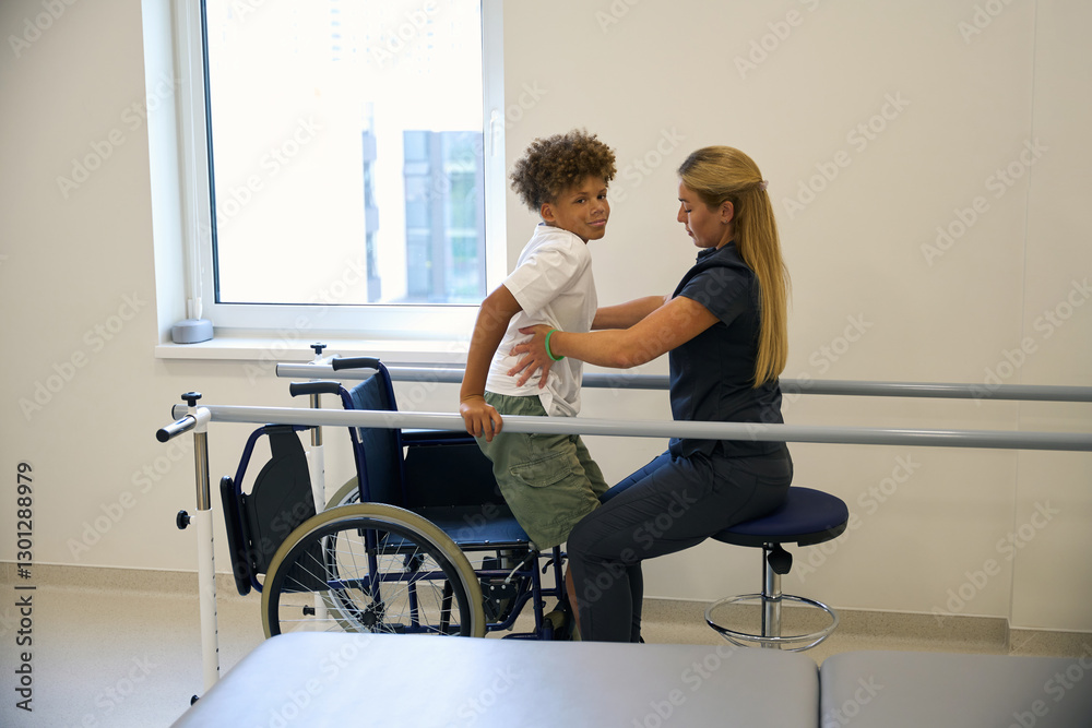 Patient practices maintaining balance while standing Patient practices maintaining balance while standing