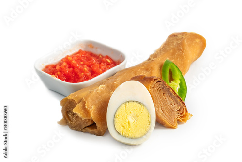 Classic Yemenite Jachnun. A classic Jewish Yemenite meal of Jachnun, grated tomato, boiled egg and hot pepper. Usually served for breakfast or lunch on Shabbat (Saturday)