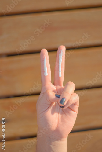 Health skin care, sunscreen, hand cream, putting on sunscreen cream