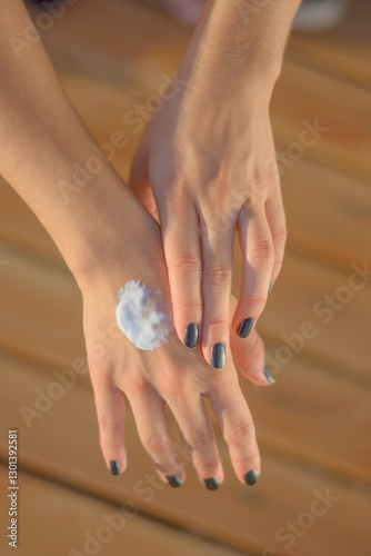 Health skin care, sunscreen, hand cream, putting on sunscreen cream