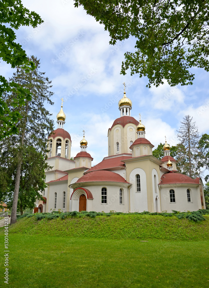 Church of the Holy Silverless Miracle Workers Cosmas and Damian on a summer day. Alexander Kosmodemyansky village, Kaliningrad Church of the Holy Silverless Miracle Workers Cosmas and Damian on a summer day. Alexander Kosmodemyansky village, Kaliningrad