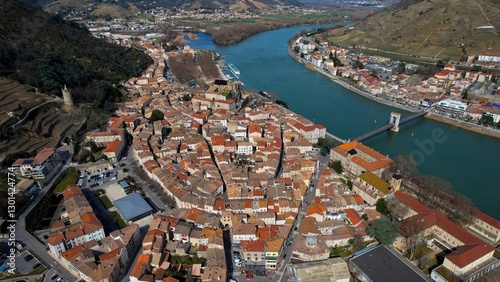 Aerial panorama view around the old town of the city Tournon-sur-Rhonein on a sunny noon in early spring
