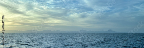 Panorama view of sea and distant misty coast for use as a background