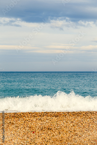 Waves Crashing on a Pebble Beach Shore