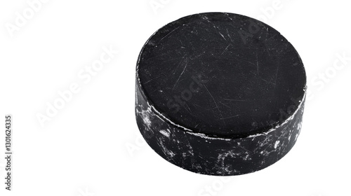 Scratched and worn hockey puck on transparent background