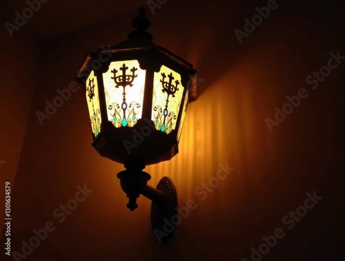 Close-up of an ornate Oktoberfest lantern with Bavarian patterns, softly lit against a dark wooden backdrop, traditional. photo