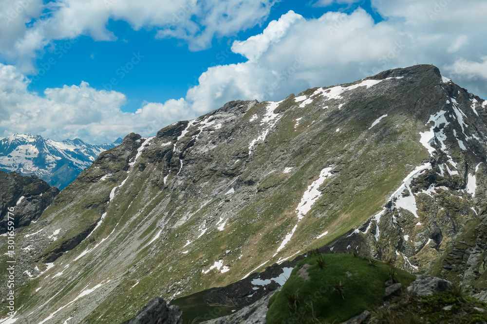 Rugged hiking trail with panoramic view of majestic mountain peak Reitereck, Ankogel Group, Carinthia, Austria. Wanderlust in remote Lieser Malta Valley in alpine wilderness of remote Austrian Alps