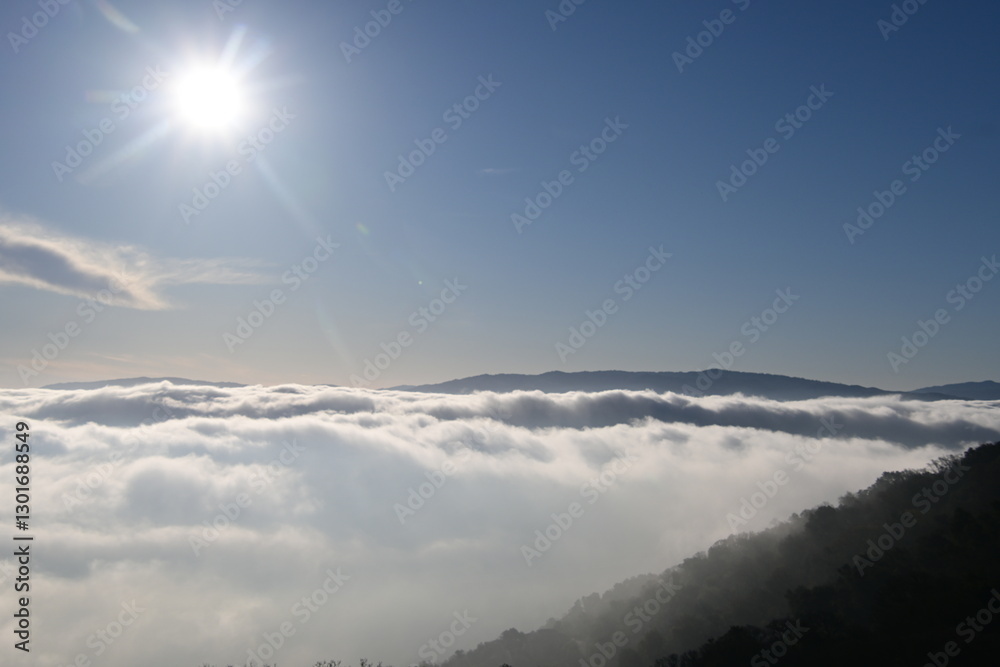 Obraz premium beautiful sunrise in the mountains over the fog and clouds