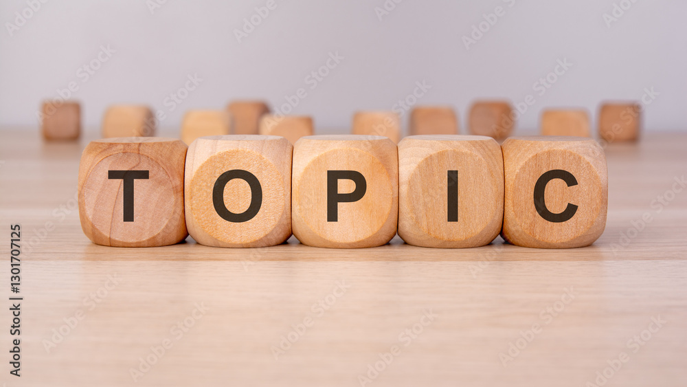 the text TOPIC is written on wooden blocks on a brown background the text TOPIC is written on wooden blocks on a brown background