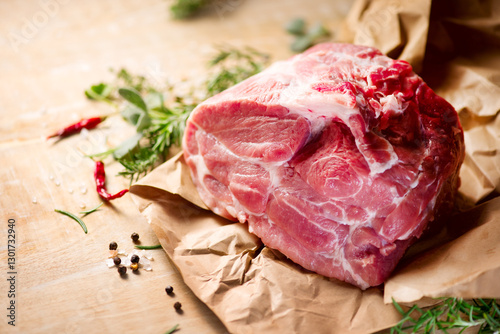 Raw Pork meat fillet. Fresh Pork meat, piece of meat close up. Prime filet meat texture. Chilled pork Boston butt, collar, shoulder. Steak. Raw pork neck, Spices. On wooden table background. 