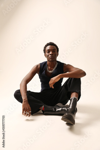 Headshot portrait of young handsome young African American man posing over light background. Vertical mock-up.