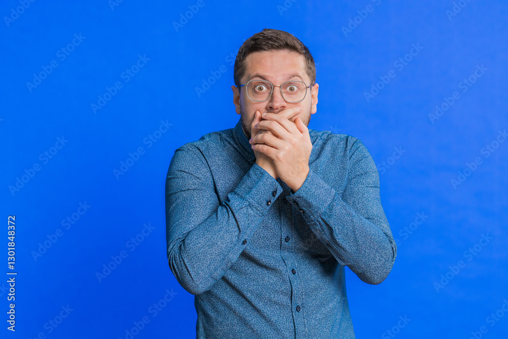 Stressed depressed middle-aged man terrified about danger problems, suffering phobia, anxiety disorder expresses fear waving no, insecure, stress, panic. Scared fearful guy isolated on blue background