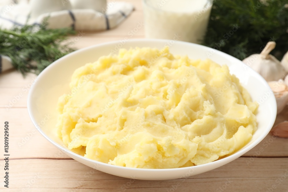 Delicious mashed potato on white wooden table, closeup Delicious mashed potato on white wooden table, closeup