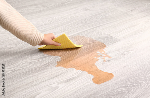 Woman wiping spilled wine f...