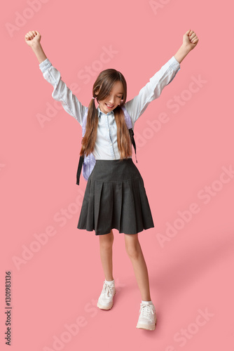 Happy schoolgirl on pink ba...