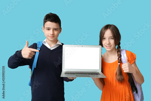 Cute schoolchildren pointin...