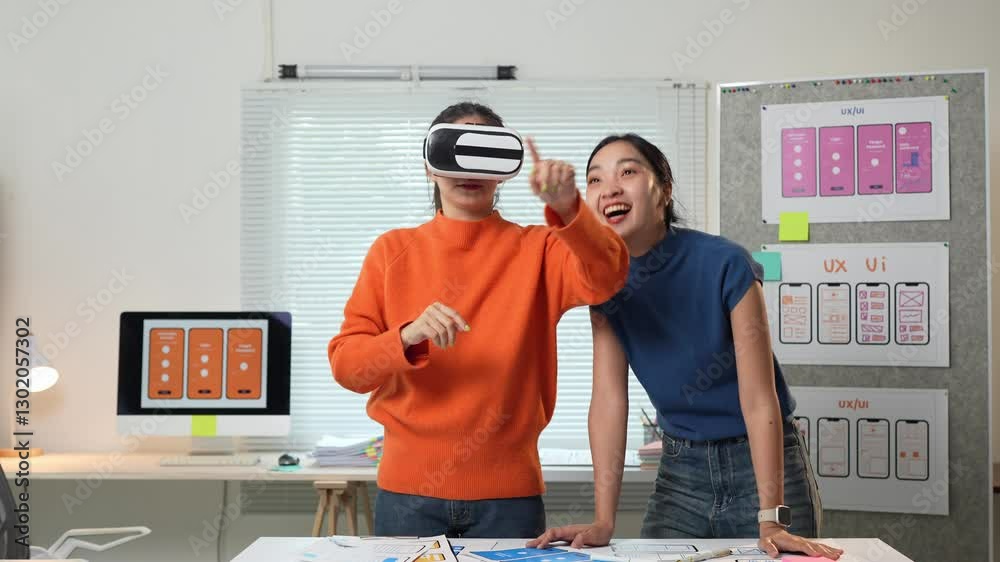 Ux designers testing virtual reality interface in modern office
